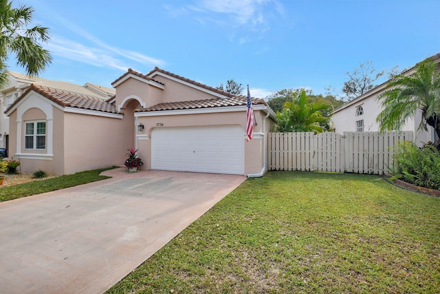 view of front of home featuring a front yard and a garage