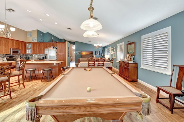 playroom featuring a chandelier, light wood-type flooring, billiards, and vaulted ceiling