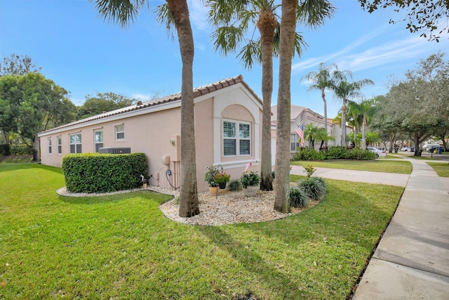 view of property exterior with a yard