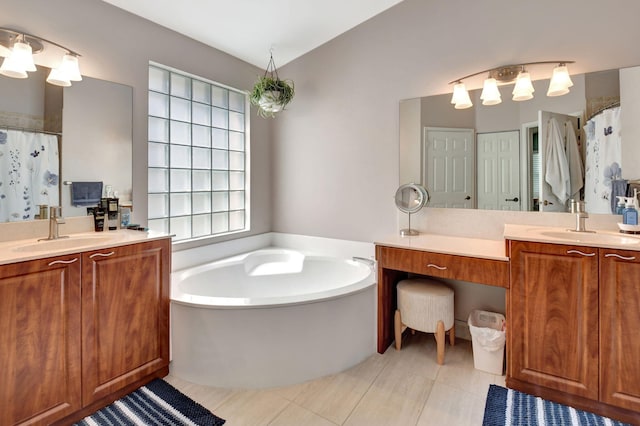 bathroom with vanity, tile patterned floors, and independent shower and bath