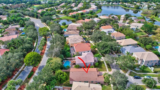 birds eye view of property with a water view