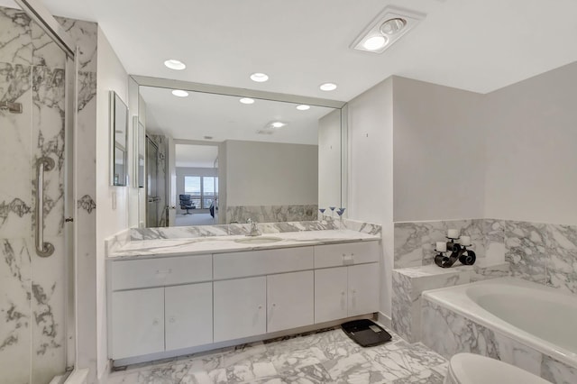 bathroom with shower with separate bathtub and vanity