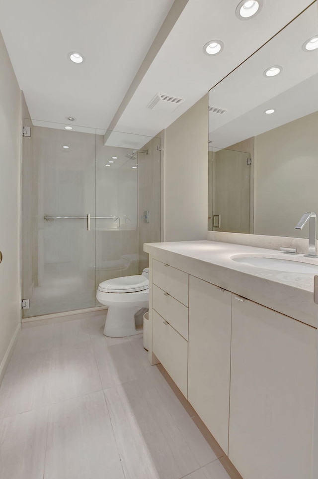 bathroom with vanity, toilet, and walk in shower