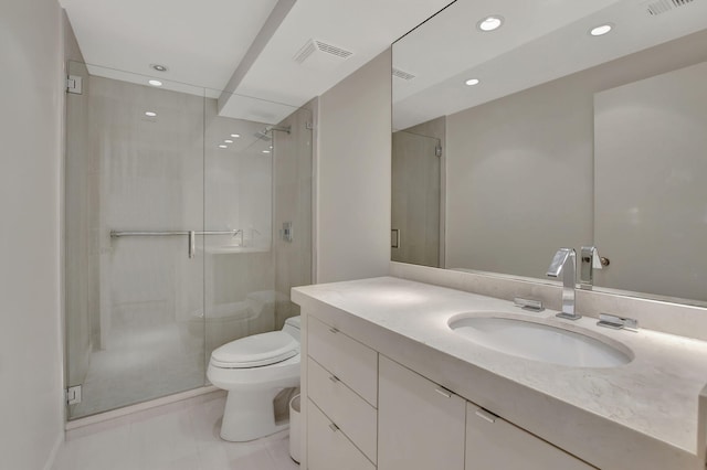 bathroom with vanity, toilet, and a shower with shower door