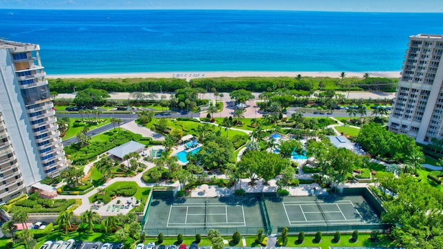 bird's eye view featuring a water view and a beach view