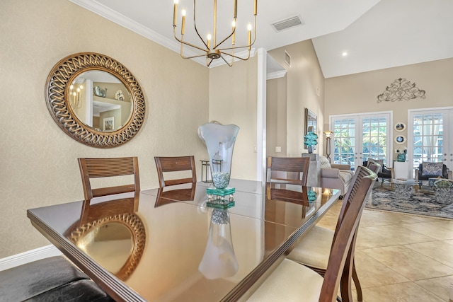 dining area featuring french doors, light tile patterned flooring, a chandelier, and ornamental molding