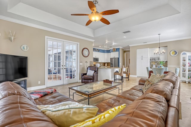 15591 Milan Ct, Wellington, FL 33414 - living room with light tile patterned floors, visible vents, french doors, and a raised ceiling