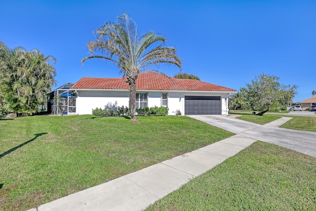 mediterranean / spanish home with a lanai, a front yard, and a garage