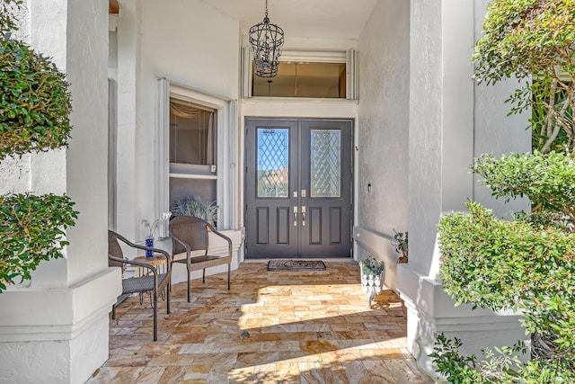 15591 Milan Ct, Wellington, FL 33414 - property entrance featuring a porch and stucco siding