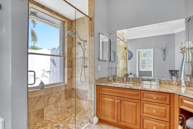 bathroom featuring vanity and a shower with shower door