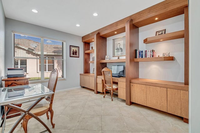 office featuring built in shelves and built in desk