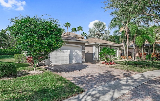 view of front facade with a front lawn and a garage