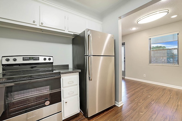 kitchen featuring white cabinetry, dark hardwood / wood-style flooring, and appliances with stainless steel finishes