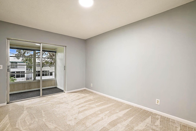 unfurnished room featuring carpet floors