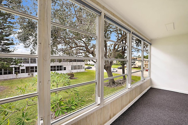 unfurnished sunroom featuring a wealth of natural light