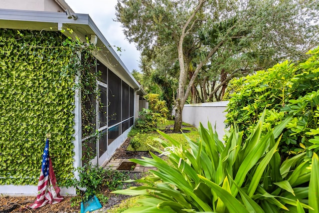 view of yard with a sunroom