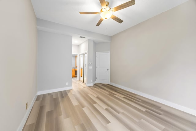 unfurnished room with light hardwood / wood-style floors and ceiling fan