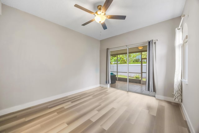 spare room featuring ceiling fan and light wood-type flooring