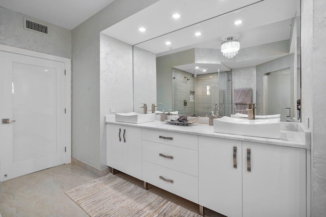 bathroom featuring vanity and an enclosed shower