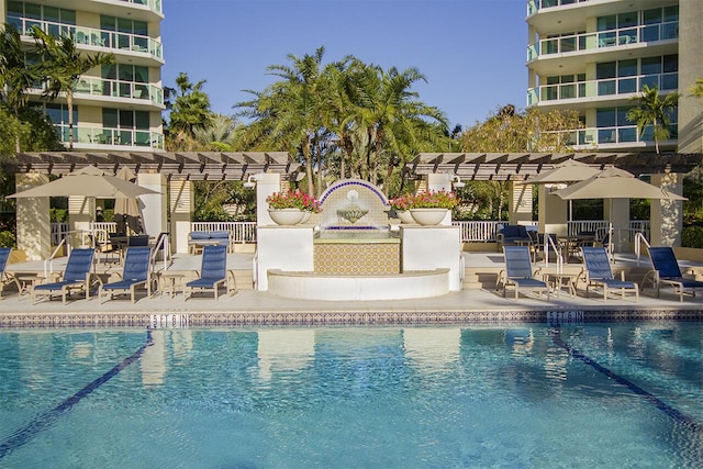 view of pool with a pergola and a patio