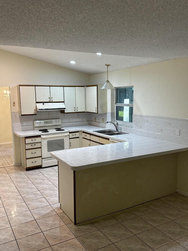 kitchen with white cabinets, hanging light fixtures, vaulted ceiling, white range with electric stovetop, and kitchen peninsula