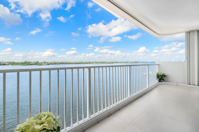 balcony featuring a water view