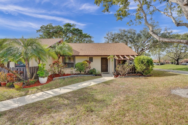 single story home featuring a front yard