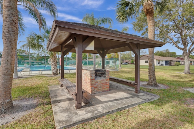 exterior space featuring a gazebo, a yard, and a pool