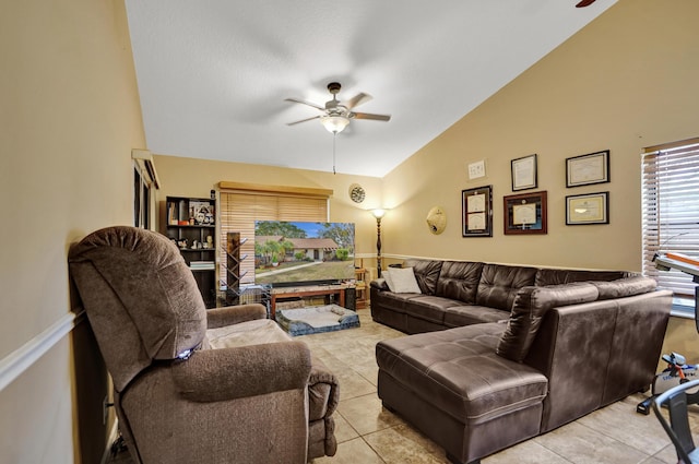 tiled living room featuring ceiling fan and lofted ceiling