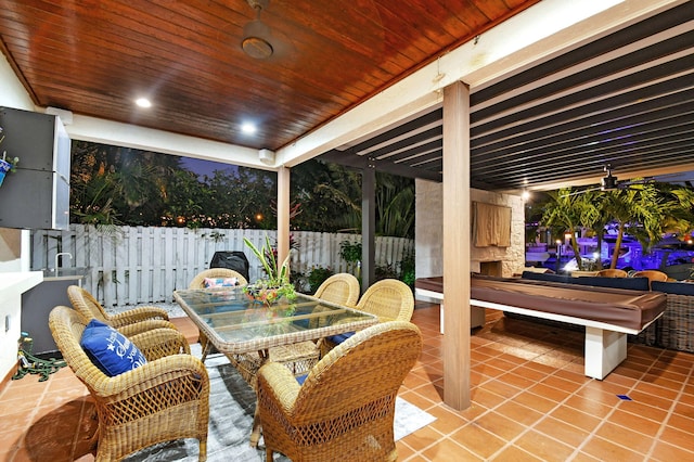 view of patio with a fireplace and ceiling fan