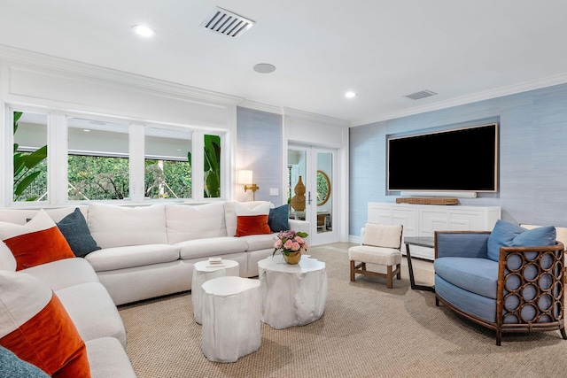 living room with ornamental molding and french doors