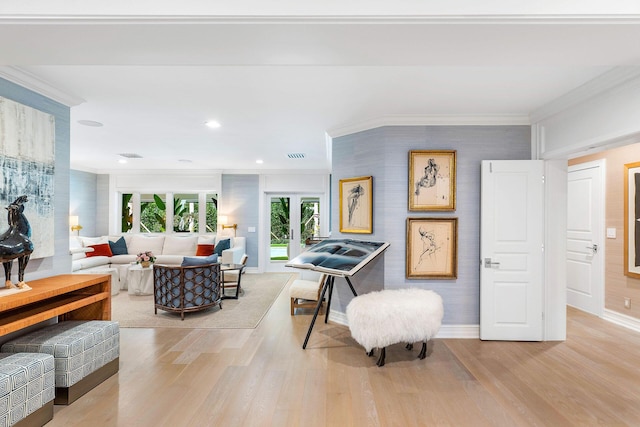 interior space with light hardwood / wood-style floors and ornamental molding