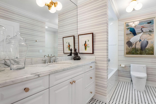 bathroom with vanity, a bathtub, toilet, and ornamental molding