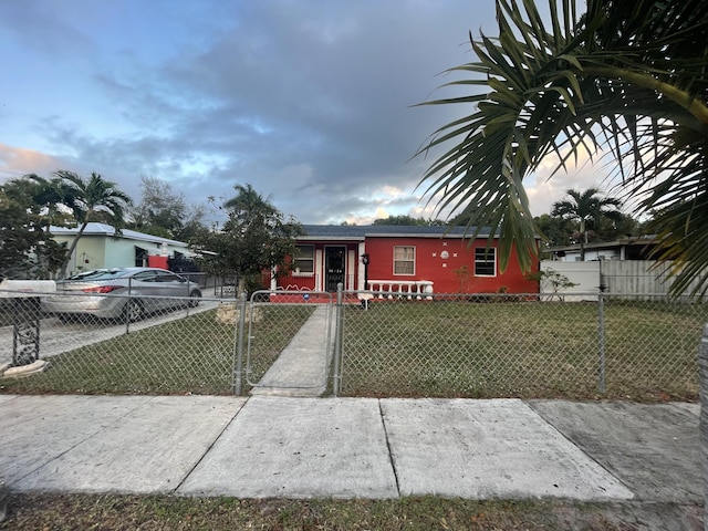 bungalow-style house with a front yard