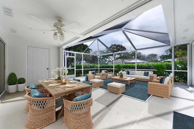 view of patio / terrace with outdoor lounge area, glass enclosure, and ceiling fan