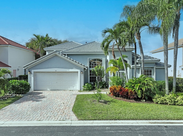 mediterranean / spanish house featuring a garage