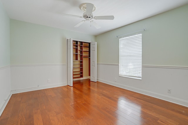 empty room featuring ceiling fan and wood-type flooring