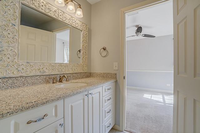 bathroom with ceiling fan and vanity