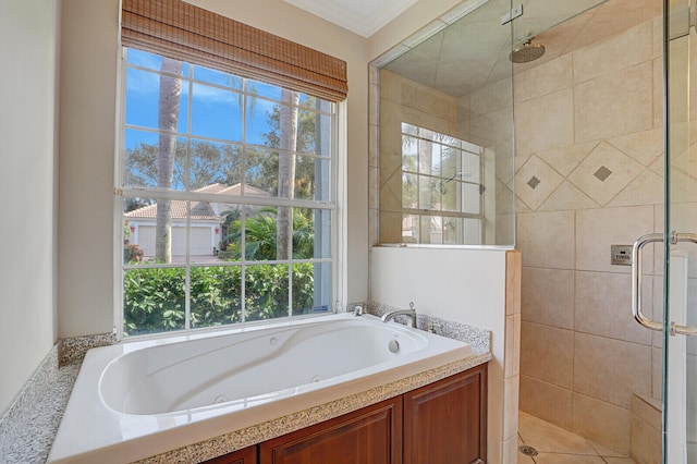 bathroom featuring separate shower and tub, a wealth of natural light, and ornamental molding