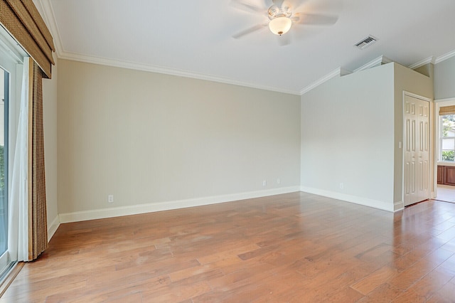 unfurnished room featuring ceiling fan, light hardwood / wood-style floors, and crown molding