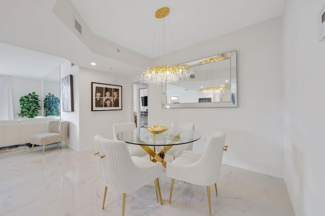 dining area with a notable chandelier