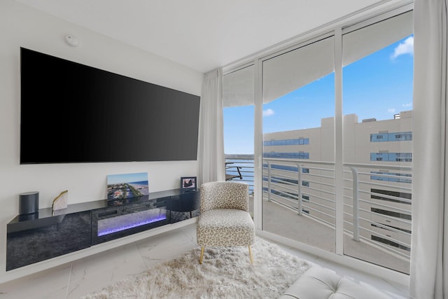 sitting room with a wall of windows