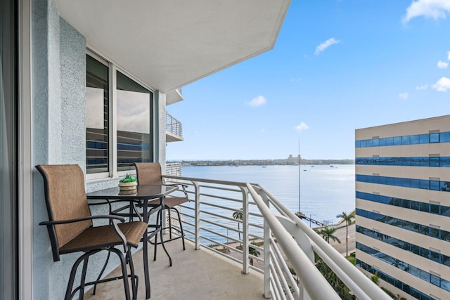 balcony featuring a water view