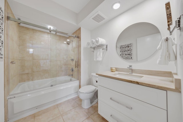 full bathroom with vanity, tiled shower / bath combo, toilet, and tile patterned flooring