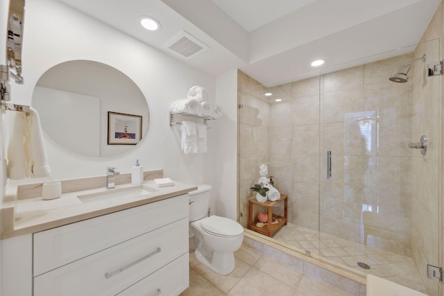 bathroom with tile patterned flooring, vanity, toilet, and a shower with shower door