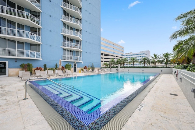 view of pool featuring a patio