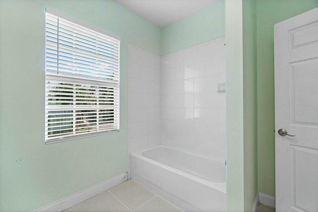 bathroom with tile patterned flooring, a shower, vanity, and toilet