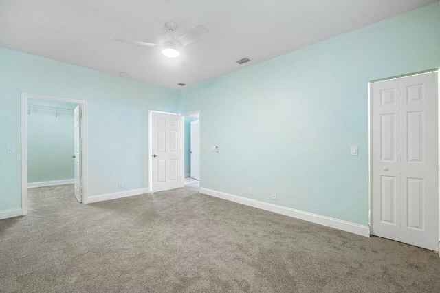 unfurnished bedroom with carpet flooring and ceiling fan