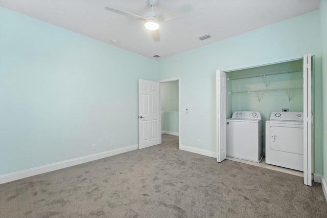 laundry area with carpet flooring, ceiling fan, and washing machine and clothes dryer