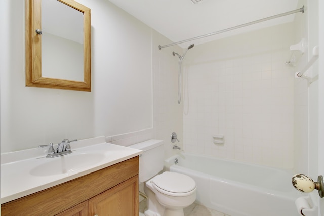 full bathroom featuring toilet, tiled shower / bath combo, and vanity